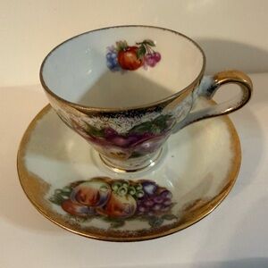 Elegant Teacup and Saucer Set With Adorable Flowers with fruit